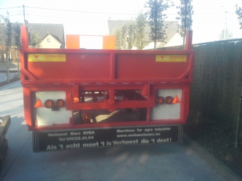 Flat trailer with folding flap